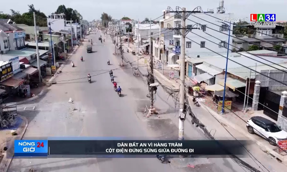 Dân bất an vì hàng trăm cột điện đứng sững giữa đường đi