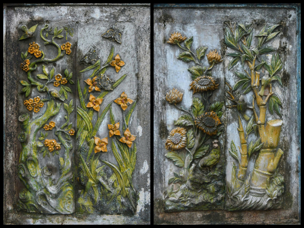 2 bên bức bình phong đắp nổi cặp tranh tứ quý Mai - Lan - Cúc – Trúc. Từ bình phong đến phần chính của mộ là đường thần đạo dài khoảng 17m